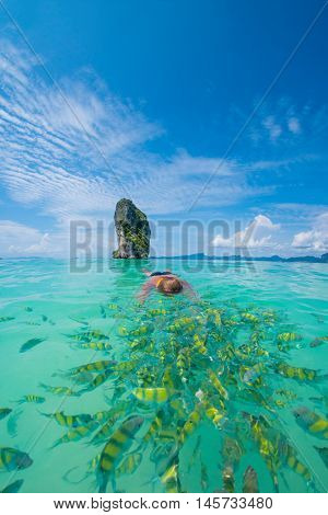 Woman swimming with snorkel, Andaman Sea Poda island, Thailand