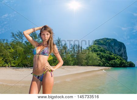 Beautiful woman relexing on the beach. Poda island. Thailand