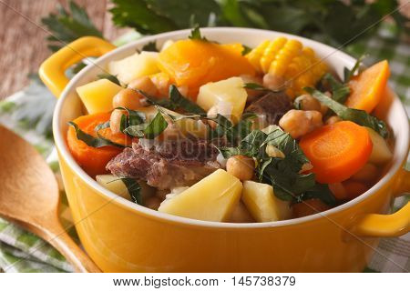 South American Cuisine: Puchero Soup With Chickpeas Close-up In A Pot. Horizontal
