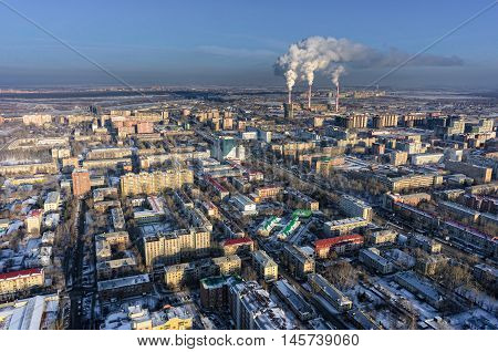 Tyumen, Russia - November 10, 2015: Aerial view on residential area and combined heat and power factory on background
