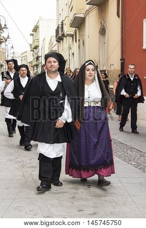 QUARTU S.E., ITALY - September 21, 2014: Parade of Sardinian costumes and floats for the grape festival in honor of the celebration of St. Helena. - Sardinia