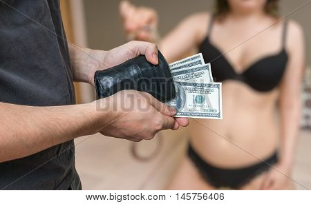 Man Is Paying A Prostitute For Sex. Escort And Prostitution Conc