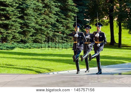 MOSCOW RUSSIA - SEPTEMBER 02 2016: Hourly change of the Presidential guard of Russia at the Tomb of Unknown soldier and Eternal flame in Alexander garden near Kremlin wall