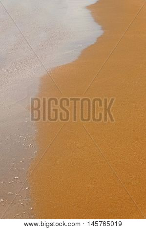 Half wet sand and wave background, a lot of space for text