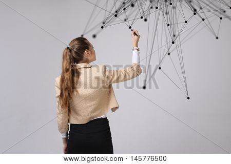 Worldwide network or wireless internet connection futuristic concept. Woman working with linked dots.