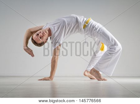 Man practicing Capoeira , brazilian martial Art.