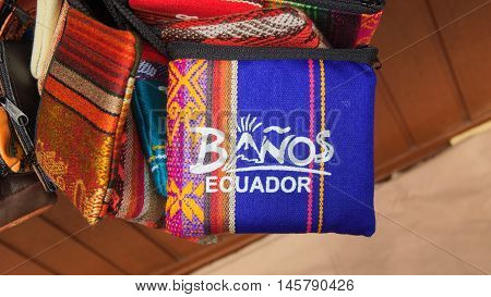 Banos de Agua Santa, Tungurahua / Ecuador - September 2 2016: Indian handmade bag sale at a craft store in the Pasaje Artesanal in the downtown of the city of Banos