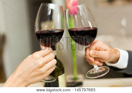 Couple toasting wine glasses