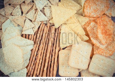 Vintage Photo, Heap Of Salted Crisps, Breadsticks And Cookies, Concept Of Unhealthy Food