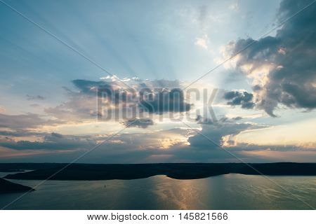 Sunset on river Dnister on reservoir Bakota Ukraine. Bay Dniester river near Bakota village