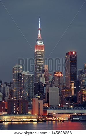 NEW YORK CITY - JUL 4: Empire State Building with skyscrapers on July 4, 2015 in Manhattan, New York City. With population of 8.4M, it is the most populous city in the United States.