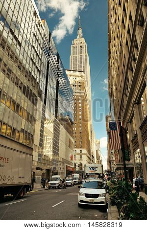 New York City - SEP 11: Empire State Building viewed from street on September 11, 2015 in New York City. With 8.5M, New York City is the is the most populous city in the United States.
