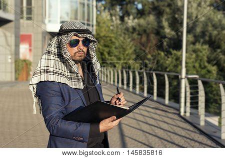 Oriental young businessman in the modern city