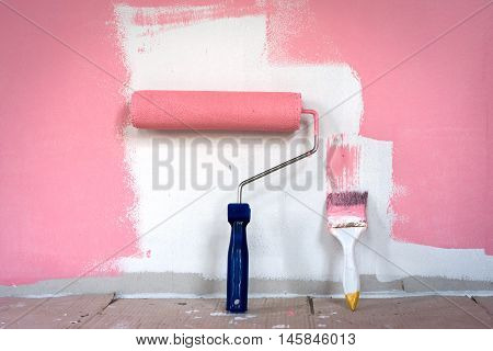 hand painting wall with paint roller home