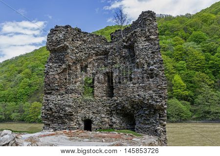 Medieval broken tower. Archaeological site on the Olt valley in Carpathian Mountains