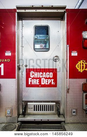Chicago, USA - August 14, 2015: Chicago Metropolitan fire trucks sits inside a fire station in downtown Chicago