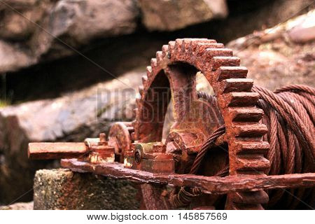 Rusted iron wheal at the coastline in the Faroe Islands