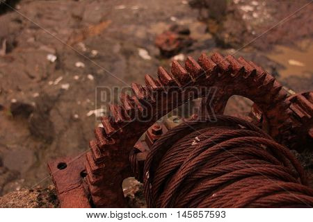 Rusted iron wheal at the coastline in the Faroe Islands
