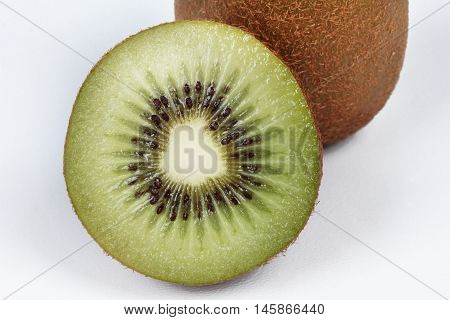 One whole and halve of  kiwi isolated on white background. Selective focus.