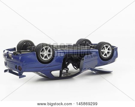 toy car over turn on the white background