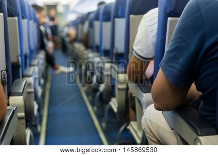 Interior Of Airplane With Passengers On Seats Waiting To Taik Off.