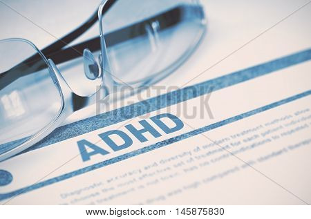 ADHD - Attention Deficit Hyperactivity Disorder - Printed Diagnosis with Blurred Text on Blue Background with Spectacles. Medical Concept. 3D Rendering.