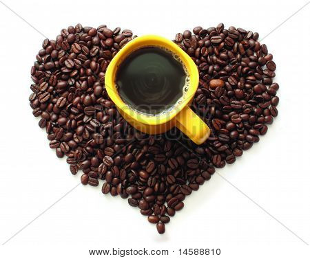 Coffee Beans And A Yellow Cup