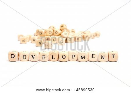 word with dice on white background - development