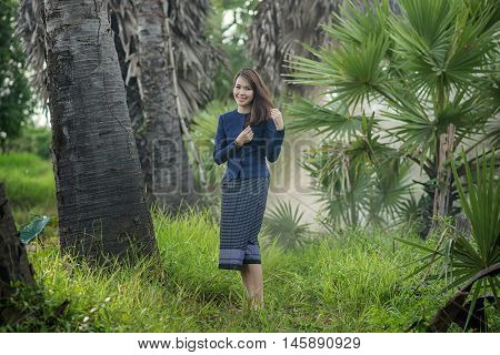 Thai Farmer Woman Wearing Typical Thai Dress, On Rice Fields Background, Identity Culture Of Thailan