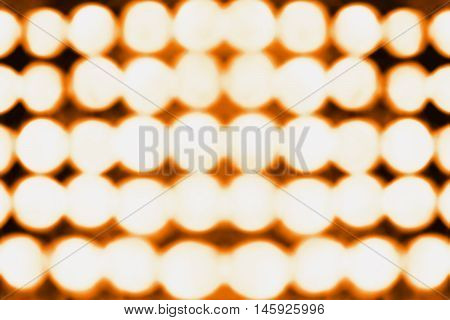 Abstract orange and black bokeh lights background or party invite for Halloween or Thanksgiving