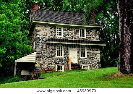 Chadds Ford Pennsylvania - June 2 2015: The historic 1725 fieldstone John Chads' House with its exterior beehive oven remains essentially in its original condition