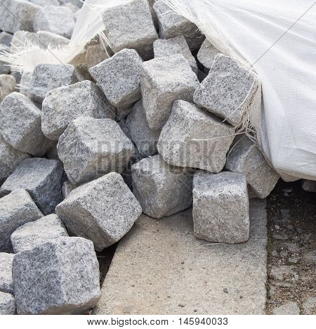 Pile Of Cobblestones With A Cracked Cotton Sack
