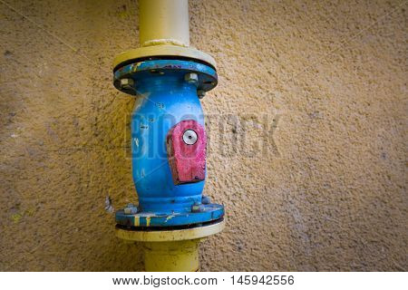 The valve on the gas pipe with a broken stick