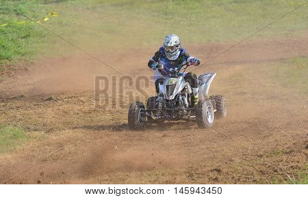 Unidentified Racer Rides A Quad Motorbike.