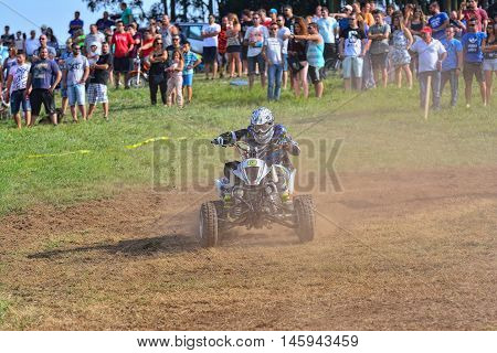 Unidentified Racer Rides A Quad Motorbike.