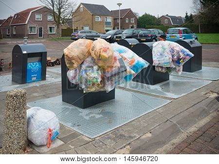 OLDENZAAL NETHERLANDS - JANUARY 1 2016: plastic bags with recyclable waste at a waste collection point