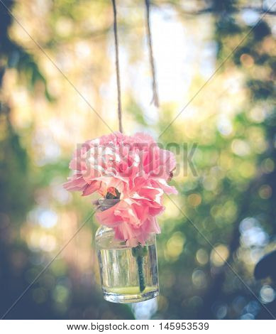 Pink Flower In Hanging Glass Bottle