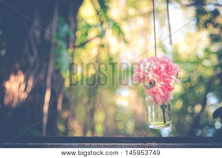 Pink Flower In Hanging Glass Bottle