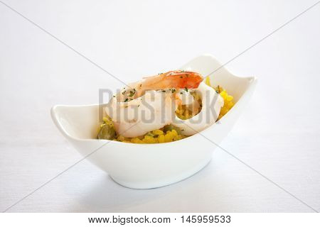 Rice blew seafood isolated in a white cup.