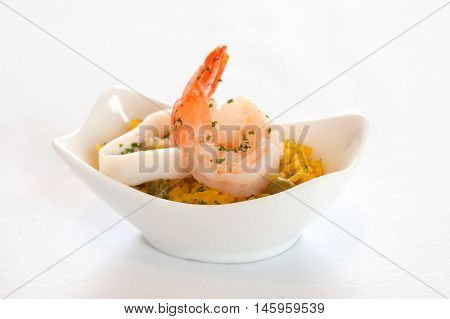 Rice blew seafood isolated in a white cup.