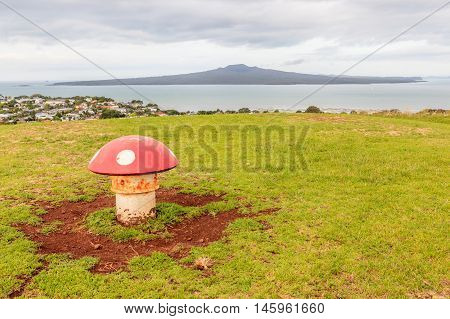 The decorated mushroom vents with Rangitoto Island background Auckland New Zealand.