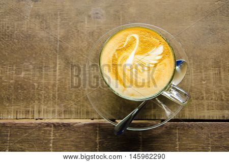 Swan Latte Art on the Wood Table