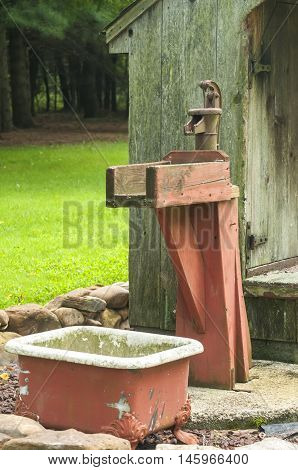 Old cast iron pitcher hand press lever water pump