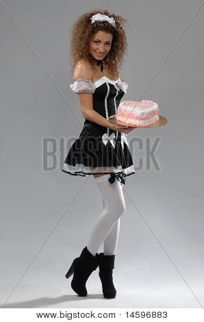 Woman Waiter Holding A Tray Of Cake