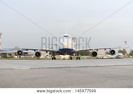 MOSCOW, RUSSIA - SEPTEMBER 26, 2014: Boeing 747 Transaero towed to the runway. Transaero Airlines has ceased to exist in 2015.