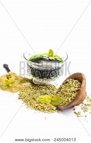 Raw Fennel With Its Powder And Its Beneficial Tea Or Extract In A Transparent Cup Isolated On White.