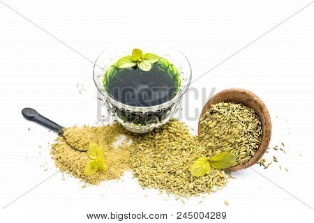 Raw Fennel With Its Powder And Its Beneficial Tea Or Extract In A Transparent Cup Isolated On White.