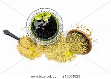 Raw Fennel With Its Powder And Its Beneficial Tea Or Extract In A Transparent Cup Isolated On White.