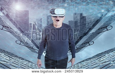 A Very Surprised Old Man In Vr Headset Against A City Buildings Background.