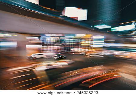 Abstract Blurred View Of People And Traffic Crossing A Busy Intersection In Shibuya, Tokyo, Japan